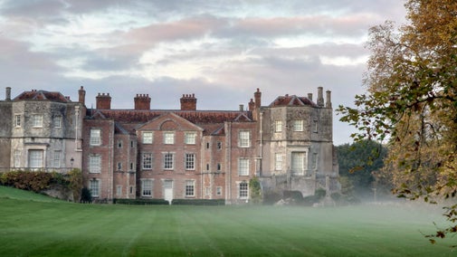 Mottisfont house and lawns with autumn mist